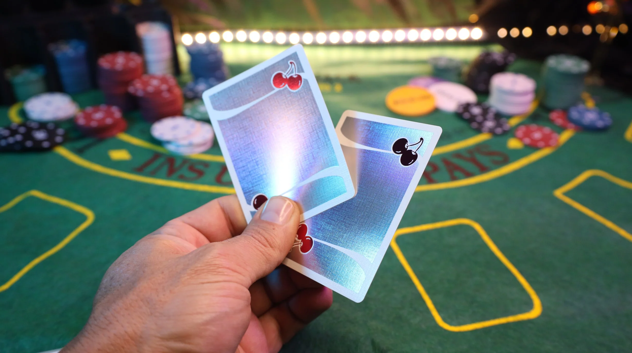 1612-cherry-casino-sands-mirage-holographic-world-s-first-double-hot-foil-playing-cards-1.webp