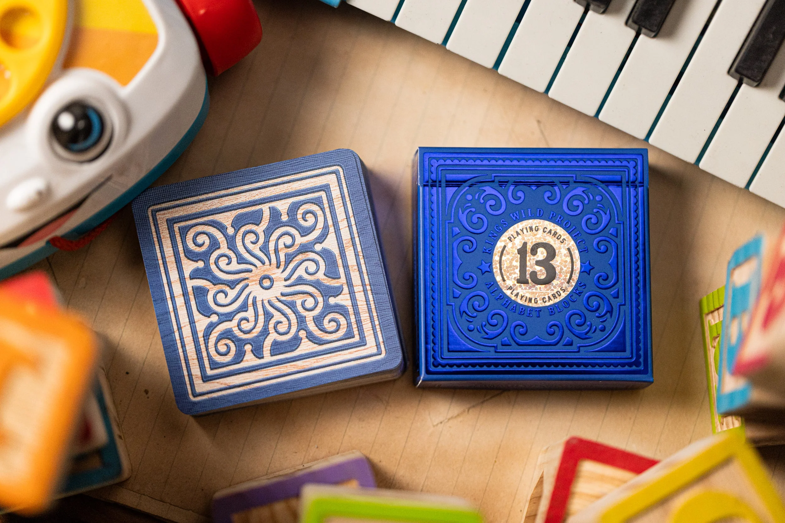 553-alphabet-blue-block-playing-cards-by-kings-wild-project-1.webp