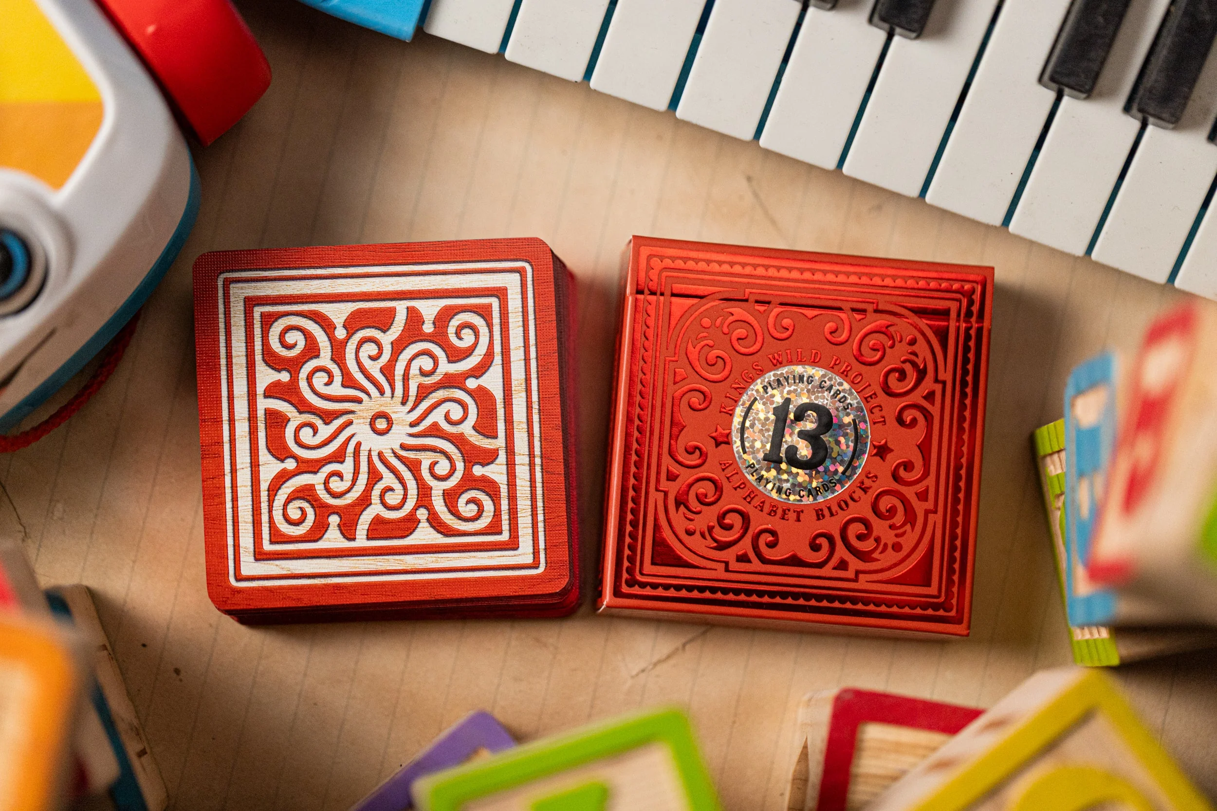 555-alphabet-red-block-playing-cards-by-kings-wild-project-1.webp