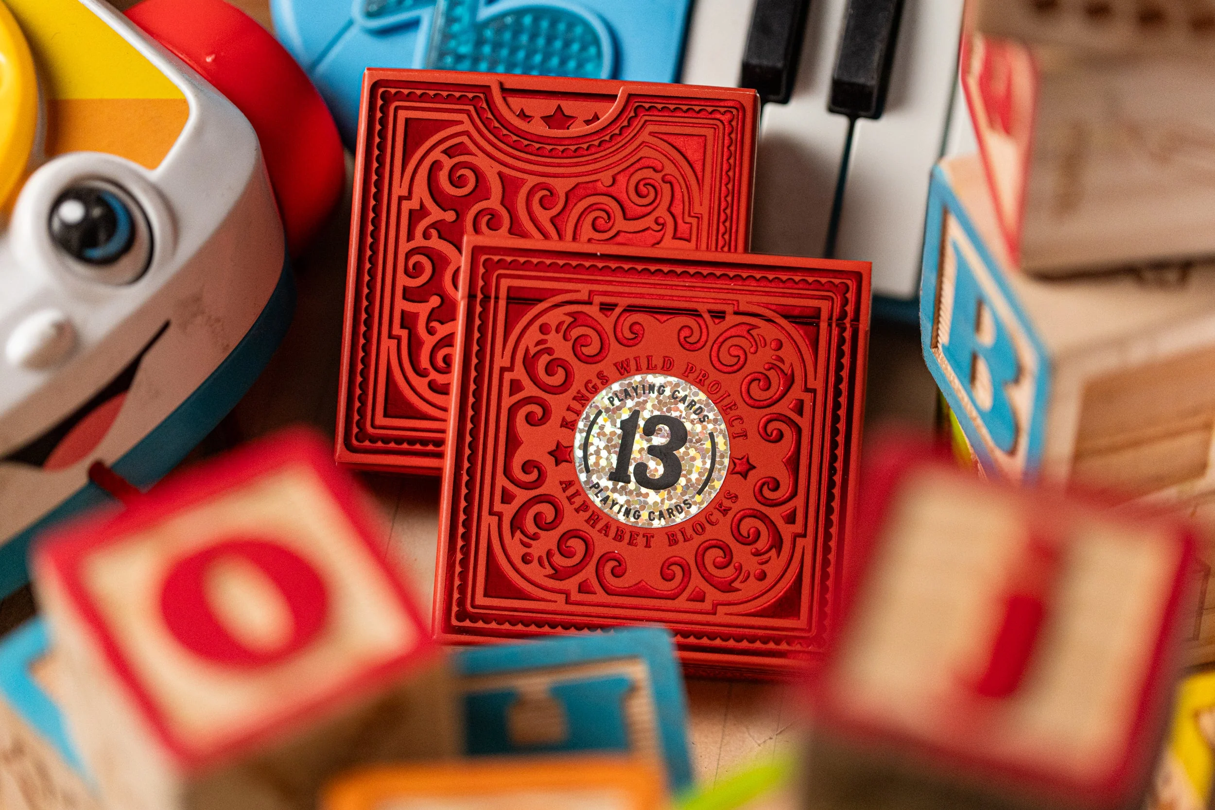 555-alphabet-red-block-playing-cards-by-kings-wild-project-1.webp