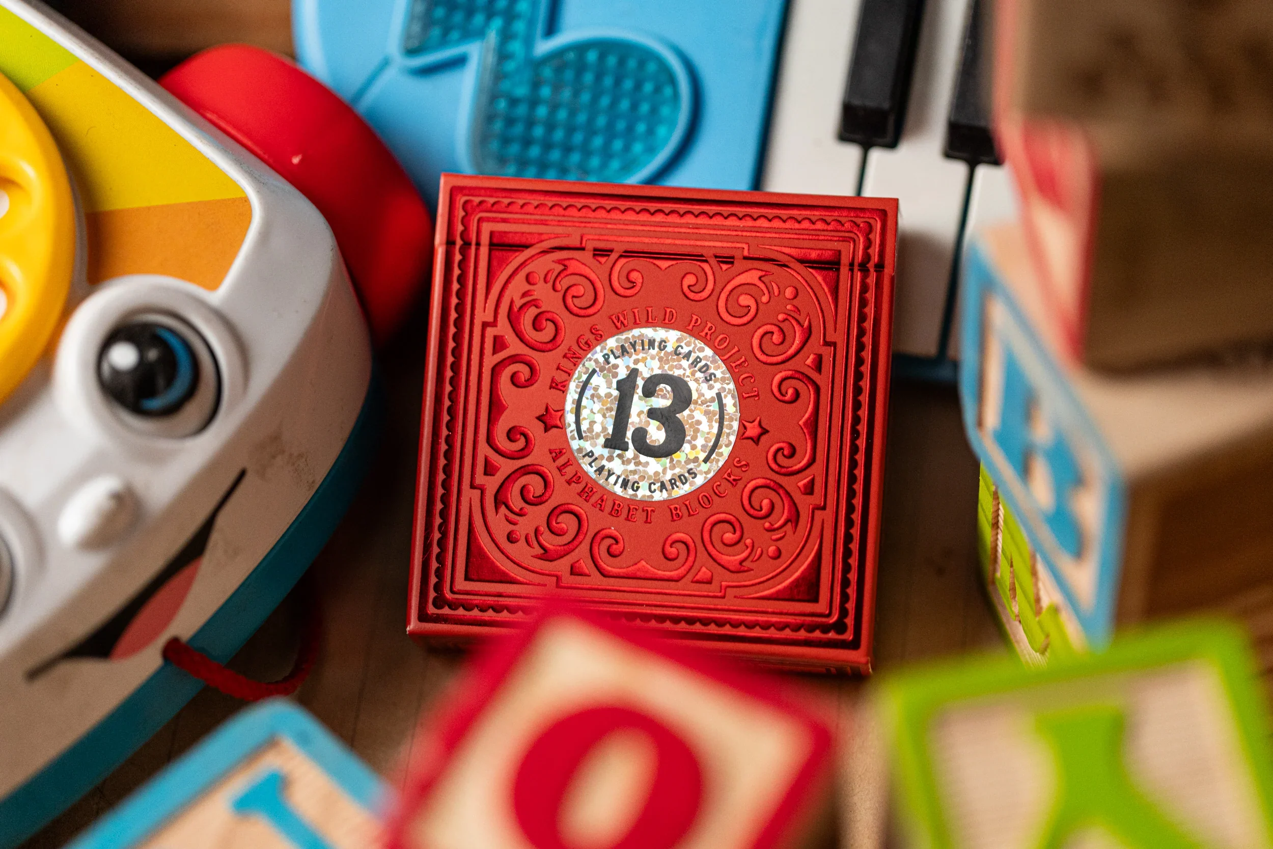 555-alphabet-red-block-playing-cards-by-kings-wild-project-1.webp